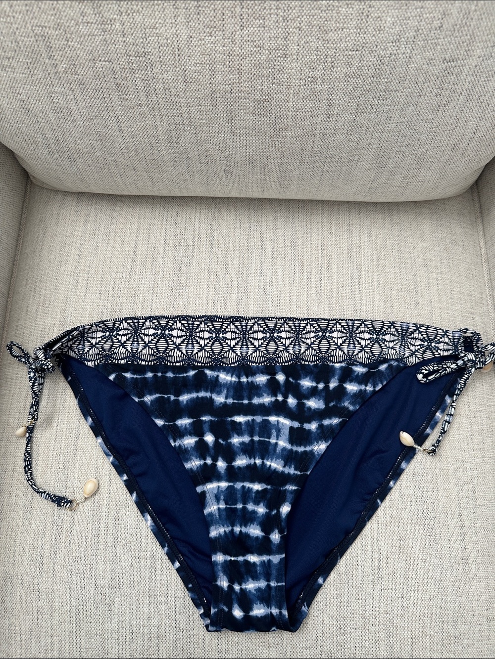 Blue tie-die look bathing suit bottom with shell detail.